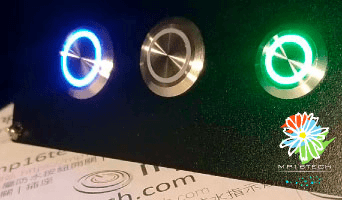 圖片GIF顯示一個雙色 LED金屬按鈕開關,可在同一棵金屬按鈕上分別顯示兩種燈色。可支援-紅綠RG 紅藍RB 雙色, 紅光 綠光 藍光。多色LED金屬按鈕開關因著雙色LED / 三色LED / 多種狀態顯示...這幾項特點適用於下列時機場合及應用 : 電池驅動模組，電動單車、電動機車、醫療/醫美/美容設備儀器、檢測儀器、KIOSK、咖啡機、小家電、AOI辨識檢測系統 以及需要直覺顯示多種燈色的設備儀器。